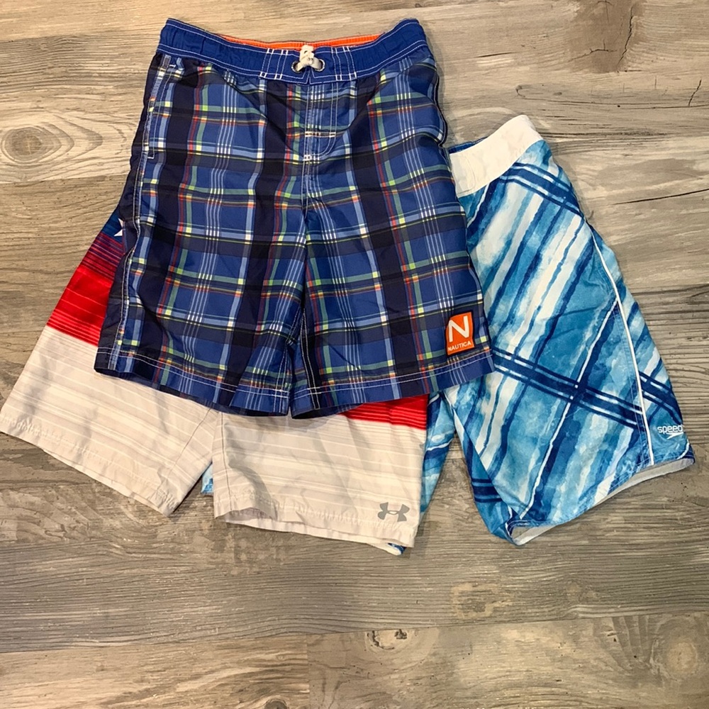 three pairs swim trunks